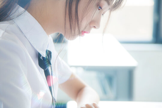 A girl in a JK uniform inside