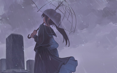 お墓の前に傘をさす女の人
