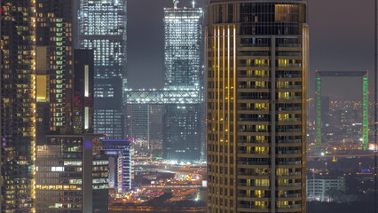 Fototapeta na wymiar Aerial view of Dubai International Financial Centre district night timelapse