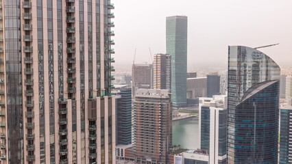 Fototapeta na wymiar Aerial skyline of a big futuristic city timelapse. Business bay and Downtown