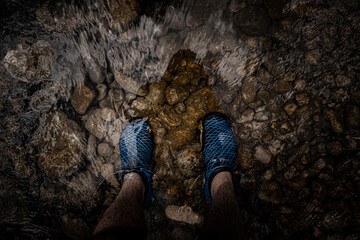 feet in the river flow