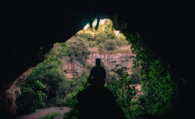 explorer finds a cave in the jungle