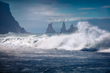 Huge storm on Atlantic ocean. Breathtaking morning view of Reynisdrangar cliffs. Spectacular summer scene of Iceland, Vik village location, Europe. Beauty of nature concept background.