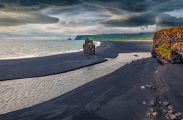 Rainy overcast on nature reserve - Reynisfjara Beach, Vik location, Iceland, Europe. Dramatic...