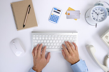 Man accountant using calculator and laptop computer in office, businessman working at home, finance and accounting concept.