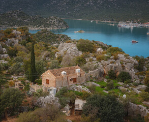 Naklejka premium Travel and tourist attractions at Kekova island, Turkey. beautiful view of seascape from Kalekoy Village, Demre, View with boat and islands in sea