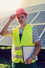 engineer in uniform working of solar power plant