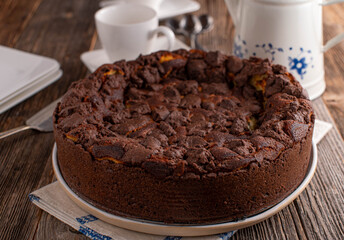 Chocolate cake with coffee on wooden table. 
