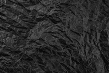 Fototapeta premium Black crumpled paper texture pattern. Rough grunge old blank.