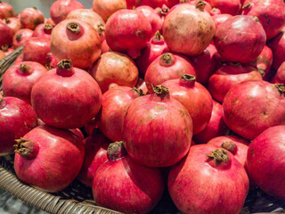 Close-up view of the pomegranates fruit selling in the food market.