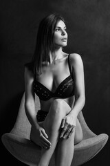 Sexy woman posing in black underwear