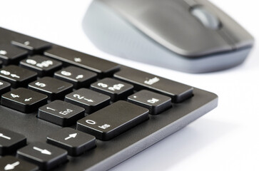 Computer mouse and keyboard on a white background.