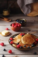 Pancakes with berries in rustic style	