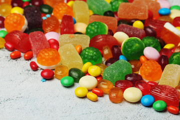 Bright candy lollies on white background