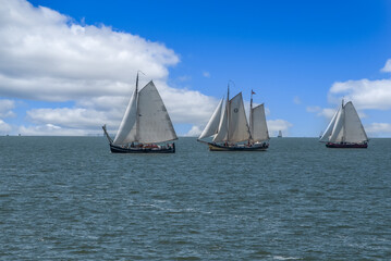 Naklejka premium Oosterleek, Netherlands, May 2022. Old traditional sailing ships on the Markermeer, Netherlands.
