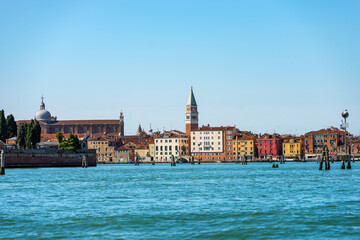 Venice cityscape with the Bell Tower of San Marco (Campanile), and the Basilica and Cathedral (St. Mark the evangelist), seen from the lagoon, UNESCO world heritage site, Veneto, Italy, Europe.