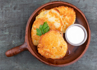 Belarusian cuisine. Potato draniki stew with sour cream