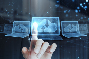 Close up of male hand pointing at abstract polygonal digital laptop with cloud computing hologram on blurry interior background. Database and information concept. Double exposure.