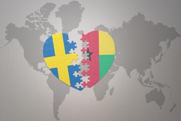 puzzle heart with the national flag of sweden and guinea bissau on a world map background. Concept.