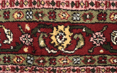 Detail of a very old Persian carpet after cleaning, washing and repairing. Close-up. Top view.