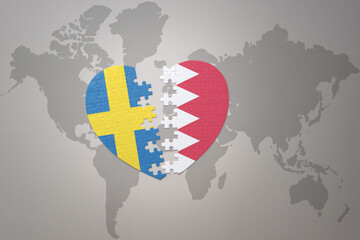 puzzle heart with the national flag of sweden and bahrain on a world map background. Concept.