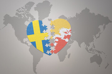 puzzle heart with the national flag of sweden and bhutan on a world map background. Concept.