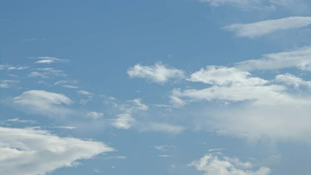 Puffy cumulus clouds swirl at sunset . Time lapse, relaxation dramatic beauty of weather atmosphere relaxation background rolling cumulus clouds