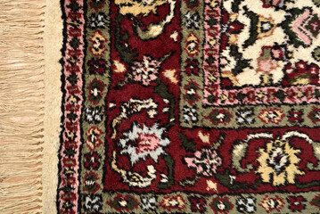 Detail of a very old Persian carpet after cleaning, washing and repairing. Close-up. Top view.