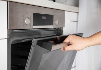 Black modern electric oven in white kitchen with thermo grill and convection function. 3d hot air and vario-grill, large