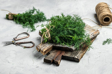 bunch of fresh organic on wooden board. Healthy and Benefit of Dill. Detox and healthy superfoods