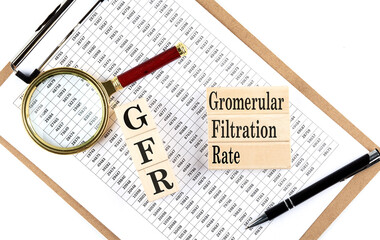 GFR - Glomerular Filtration Rate text on wooden block on chart background
