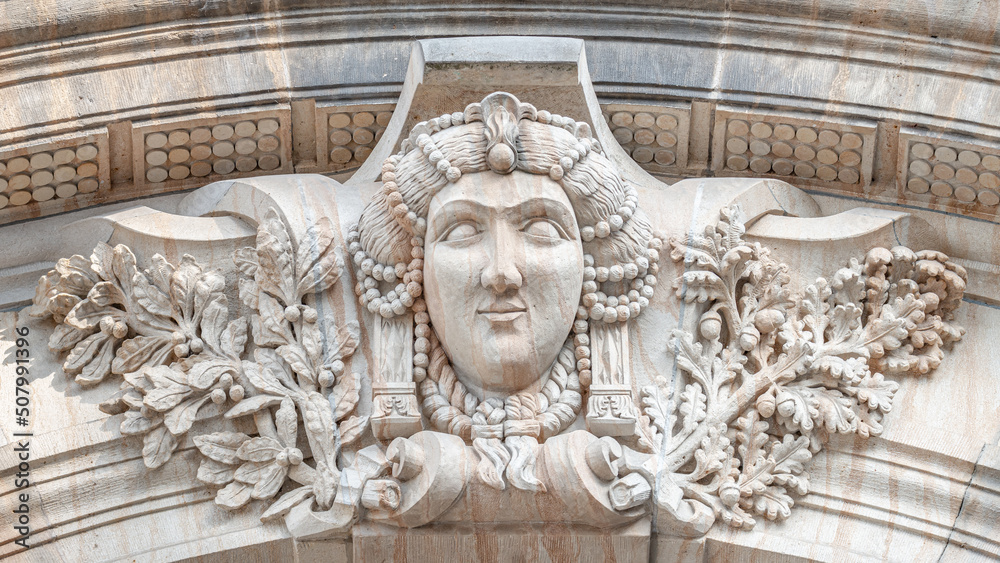 Wall mural old relief bar, a keystone in a building arch, of a woman face in the historical downtown of dresden