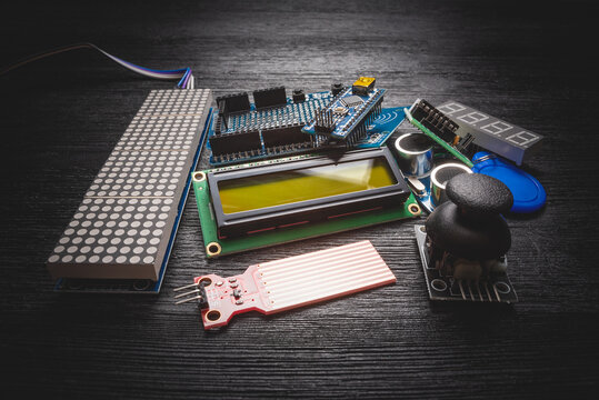 Microprocessor programming parts on the black table concept background.