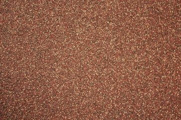 The texture of the surface of the wall sprayed with small pebbles.