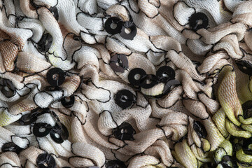 Gray pleated material, background. Macro, textured