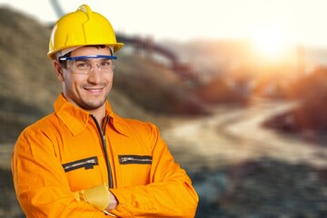 Construction worker in hard hat on building  background
