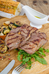Grilled steaks on dinner table