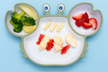 Baby Led weaning, blw. First baby food. Silicon plate with mixed vegetable. Healthy nutrition for...