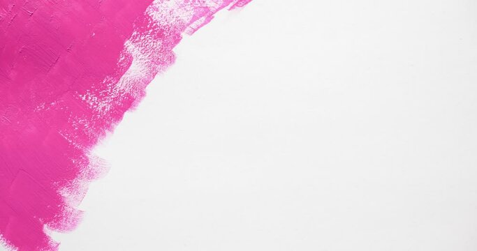 Filling the white background with bright pink paint. Artistic brush strokes. Looped 4K stop motion animation