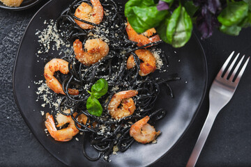Black shrimp pasta with olive oil and parmesan.
