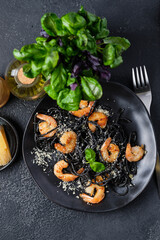 Black shrimp pasta with olive oil and parmesan.