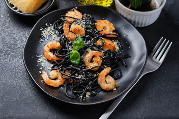 Black shrimp pasta with olive oil and parmesan.