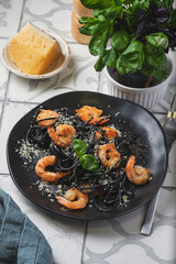 Black shrimp pasta with olive oil and parmesan.