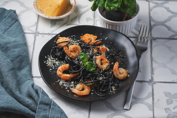Black shrimp pasta with olive oil and parmesan.