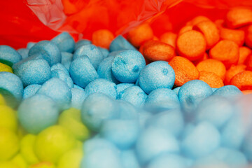 Candy sweets marshmallows. Close up view of delicious sweet round candies. Fruit jelly in shop window. Sweets for Easter, Halloween. Unhealthy or organic food. Selective focus. Top view 