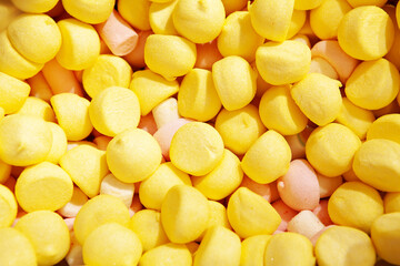 Candy sweets marshmallows. Close up view of delicious sweet round candies. Fruit jelly in shop window. Sweets for Easter, Halloween. Unhealthy or organic food. Selective focus. Top view 