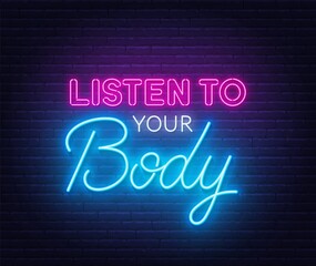 Obraz na płótnie Canvas Listen Your Body neon quote on a brick wall.