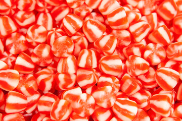 Candy sweets jelly. Close up view of delicious sweet red white candies. Fruit jelly in shop window. Sweets for Easter, Halloween. Unhealthy or organic food. Selective focus. Top view 