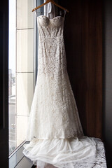 Wedding dress hanging on the wall in the hotel