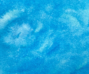 Watercolor texture in blue color on a marine or winter theme.